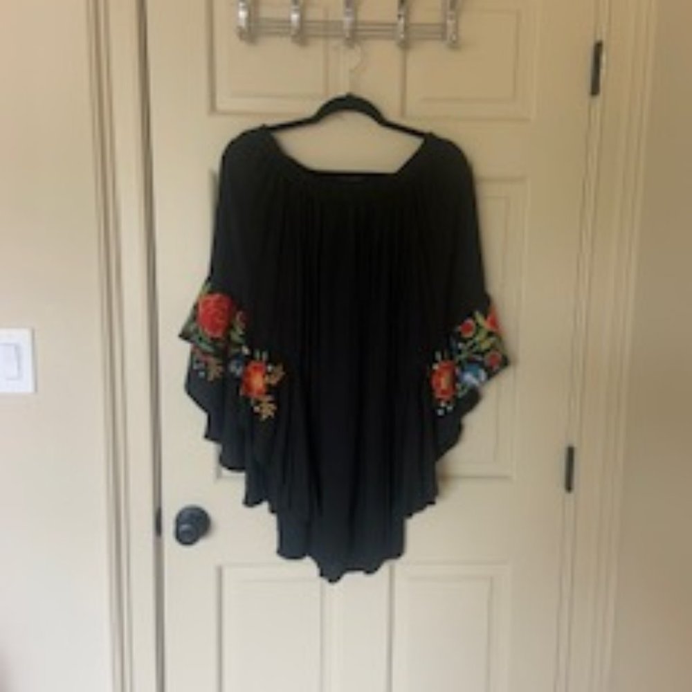 Black off the shoulder dress with flower detail